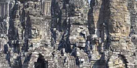 Panoramic image of giant stone-carved faces of the Bodhisattva Lokeshvara, also known as