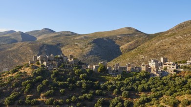 Historic village on sunlit hills, Vathia, residential tower village, Mani peninsula, Peloponnese,