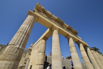 Super wide angle shot, Ancient ruins with columns under a clear blue sky on a sunny day full of