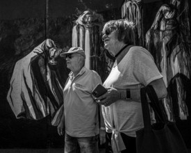 Black and white photograph, senior couple at the East Side Galery, Berlin, Germany, Europe