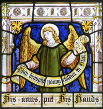 Detail of angel on stained glass window 'Suffer the Little Children' by Burlison & Grylls c 1880,