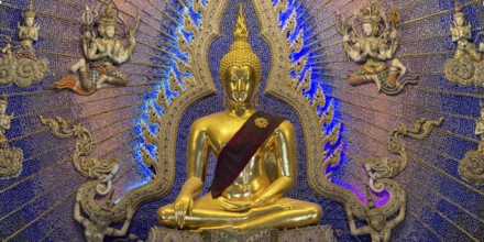 Golden Buddha statue with tunic, Bhumispara-mudra, Buddha Gautama at the moment of enlightenment,