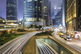 Traffic with streets and skyscrapers in the city of Hong Kong at night in Hong Kong, China, Asia