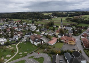Drone shot, view of village with parish church, Rutzenmoos, Hausruckviertel, Upper Austria,