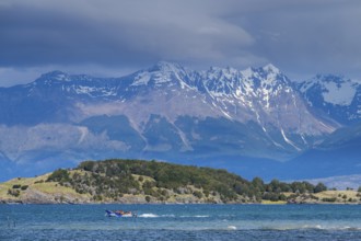 Motorboat with tourists travelling fast on the lake Lago General Carrera, also Lago Chelenko,