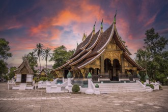 Lovely sunset at a lovely temple in Luang Prabang in summer, Laos, Asia