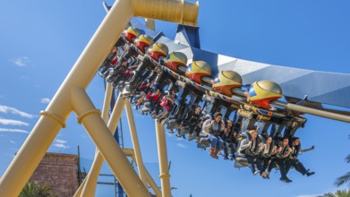 Park guests riding Montu roller coaster at Busch Gardens in Tampa, Florida, USA, North America