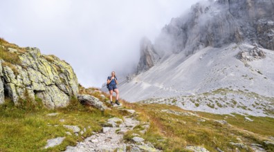 Hiker on the ascent to the Great Kinigat, Carnic Main Ridge, Carnic High Trail, Carnic Alps,