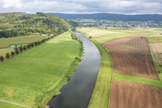 Aerial view over fields and meadows at the Weser river, east of village Wahmbeck, Weserbergland,
