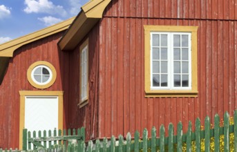Typical architecture of Greenland capital Nuuk with colored houses located near fjords and icebergs
