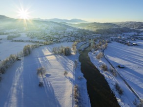 Aerial view of a river and a village in front of mountains, winter, evening light, Großweil, Alpine
