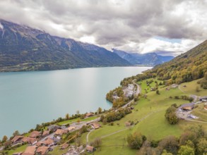 Sweeping views over a large lake with surrounding mountains, villages and meadows, Lake Brienz.