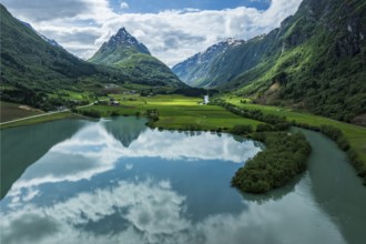 Mountain Eggenipa reflected in lake Bergheimsvatnet, south of Byrkjelo, Norway, Europe