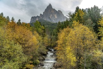 Autumn at the Schwarzgriesbach stream and the Schlern mountain in Seis am Schlern, South Tyrol,