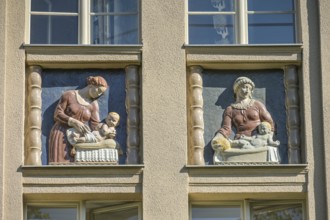 Mothers looking after their babies, relief on an old building, former woman's and children's