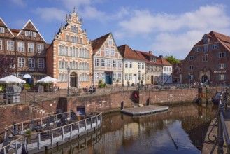 Harbour basin with railings and gabled and old half-timbered houses on the waterfront West in the
