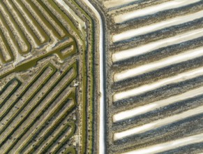 Saline ponds at the salt works near Chiclana de la Frontera. Aerial view. Drone shot. Cádiz