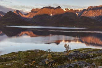 Fjord with steep mountains in autumn, morning light, clouds, Oksfjord, Finnmark, Norway, Europe