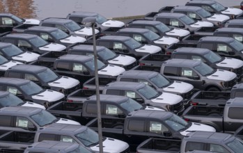 Ford FX4 pickup trucks on stockpile, in the overseas harbour of Bremerhaven, after import from the