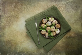 Grape snails stuffed in Burgundy, with butter and herbs, French cuisine, no people