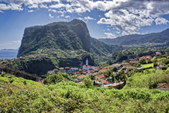 The village of Faial with a view of the landmark Eagle Rock from the Miradouro do Fortim viewpoint,