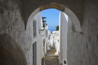 Narrow passageway with arches in a medieval town overlooking the sea, Chora, main town of Patmos,