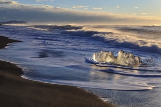 Ice floes on the beach, waves, sunny, morning mood, winter, Diamond Beach, Breidamerkursandur,