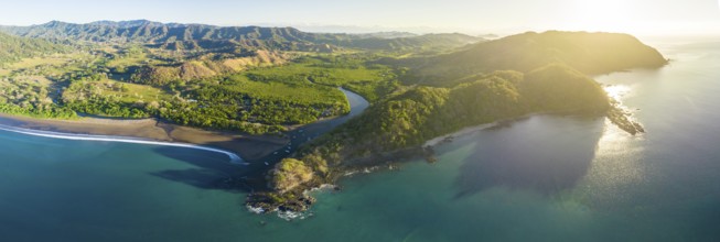 Aerial view, coastal landscape at sunset with mountains and forest, Pochote, Puntarenas, Costa