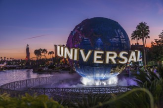 Lighted globe fountain near entrance to Universal Studios theme park in Orlando, Florida, USA,