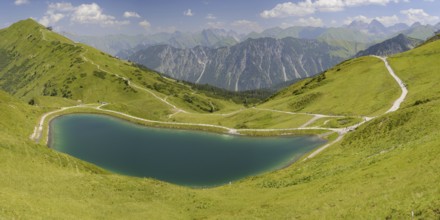 Riezler Alpsee, an artificial lake, snow pond, feeds the snow cannons that completely cover the