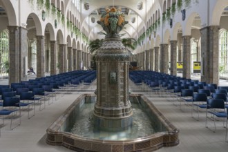Decorative, Art Nouveau ceramic fountain made of majolica tiles, in the fountain house, Heilbad