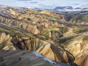 Early snow on the colorful rhyolite mountains, Landmannalaugar, Fjallabak Nature Reserve, Iceland,