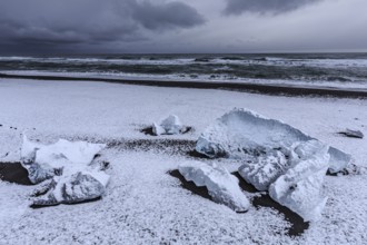 Ice floes on the beach, snowy, waves, sea, clouds, winter, Diamond Beach, Breidamerkursandur,