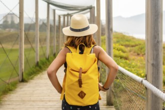 Summer vacation lifestyle. Young and adventurous girl enjoying the summer walking alone along the
