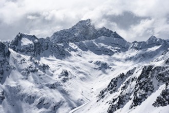 View at the summit of Piz Laviner, mountain panorama in winter, mountain landscape with mountain
