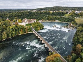 Aerial view of the Rhine Falls with railway viaduct and Laufen Castle in autumn, Neuhausen, Canton
