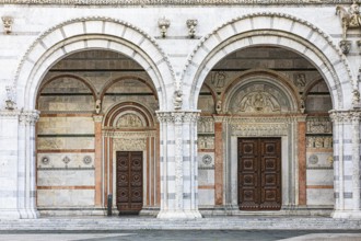 Arched entrance portals of the Cathedral of San Martino, historic city centre, Lucca, Tuscany,