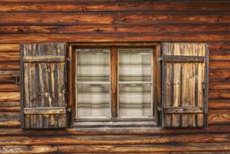 View of the window of a hut on the Glatsch Alm, Dolomites, Puez-Geisler nature park Park, Odle
