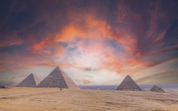 Pyramids of Giza at sunset, the oldest Funerary monument in the world. In the city of Cairo, Egypt,