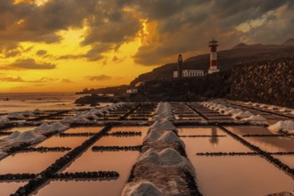 Sunset at the Fuencaliente Lighthouse next to the salt flats, on the route of the volcanoes south