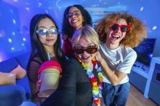 Four diverse friends enjoying a home disco party, taking a selfie with colorful lights, drinks, and