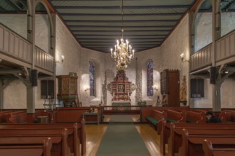 Interior of a church with chandeliers, wooden benches and wooden altar, Skedsmo Pilgrim Church,