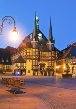 Market square with atmospherically illuminated town hall in the evening, Wernigerode, Harz,