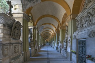 Arcade with tombs at the Monumental Cemetery, Cimitero monumentale di Staglieno), Genoa, Italy,