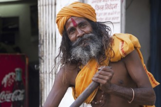 Close-up portrait of Hindu man wearing red bindi on forehead in Udaipur, Rajasthan, India, Asia