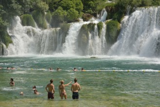 Tourists taking a bath at the Skradinski buk waterfalls, Krka National Park, Šibenik-Knin County,