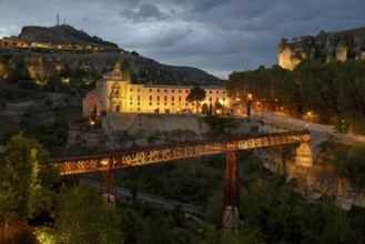 Illuminated Old Town of Cuenca with San Pablo High Bridge at dusk, Castilla-La Mancha Region,