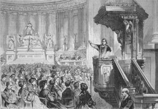 Monsignor farmer preaching from the pulpit in the Church of St. Mary Magdalene, La Madeleine,