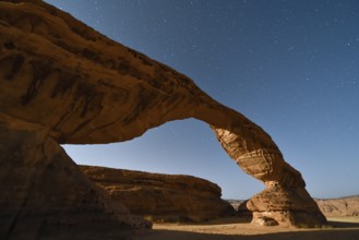 Starry sky above The Arch, also known as Rainbow Rock, near AlUla, Medina Province, Saudi Arabia,