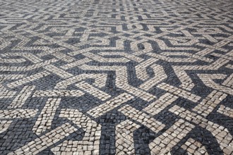 Portuguese mosaic paving, black and white paving motif, Praça dos Restauradores, Lisbon, Portugal,